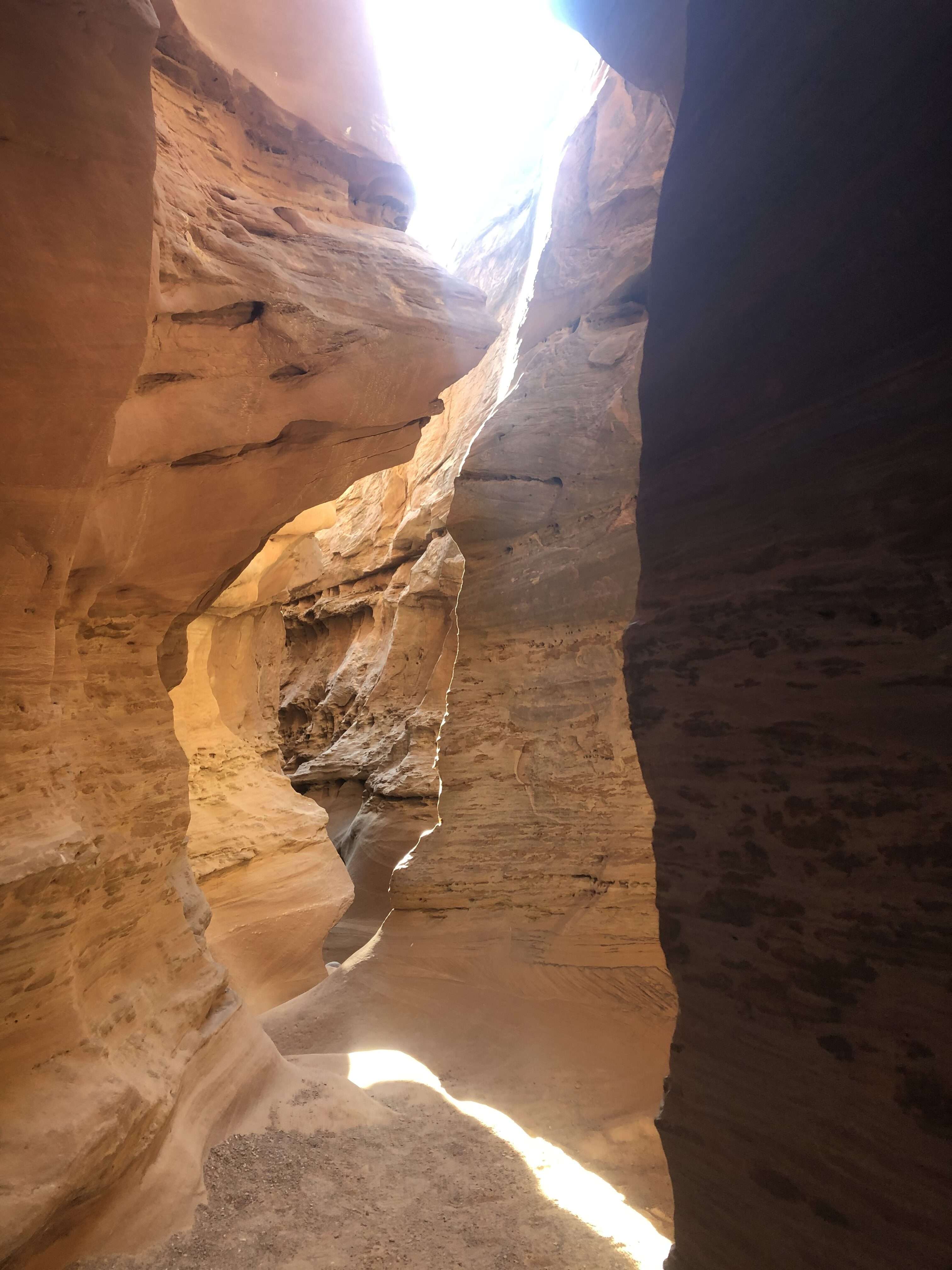 Sunny trail through a slot canyon in Utah